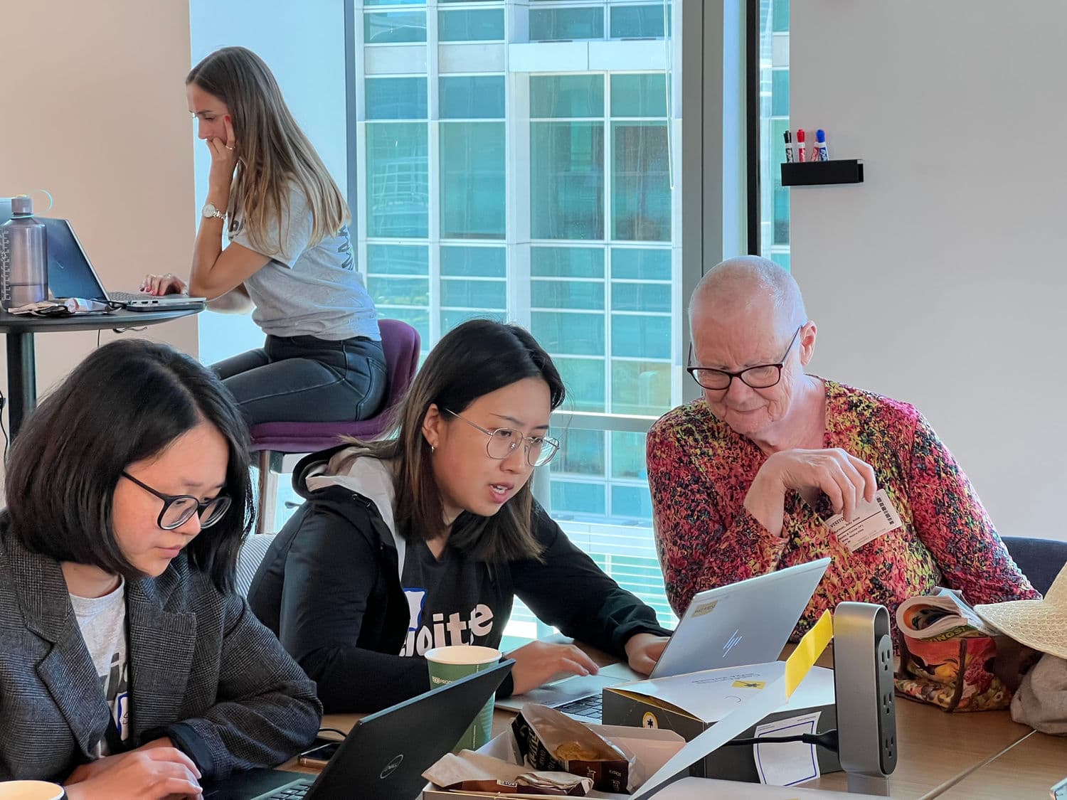 ShelterTech volunteers and community representatives working together at a Datathon